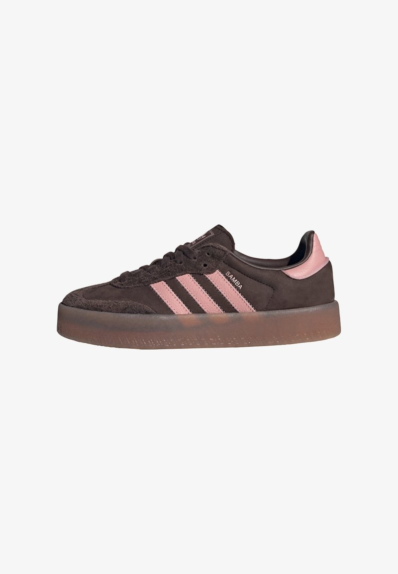 Brown Adidas Samba sneaker with pink stripes and heel tab, suede upper, and gum rubber sole, viewed from the side.