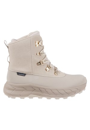 Light beige waterproof boot with a textured upper, gold hardware, and a thick, ridged sole. Features lace closure and reinforced ankle support.