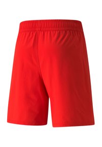 Pantalones cortos deportivos rojos con cintura elástica, hechos de una tela ligera, con una textura suave y sin patrones o acentos visibles.