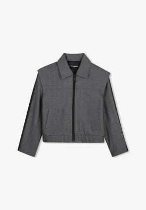 Veste courte grise avec petits points noirs, fermeture éclair devant, col, manches longues et deux poches avant.