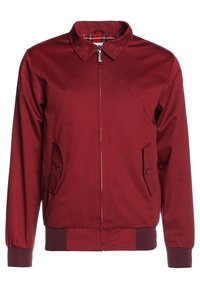 Giubbotto bomber bordeaux in tessuto liscio, con zip frontale, due tasche inclinate e polsini e orlo a coste. Foderato internamente con motivo a quadri visibile.