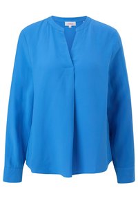 Blouse bleu à manches longues avec un col en V, offrant une coupe décontractée, un tissu doux et des fentes sur les côtés pour faciliter le mouvement. Texture lisse sans motifs.