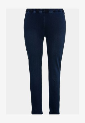 Jeggings in denim blu scuro con un design aderente, vita elastica e texture liscia. Hanno una gamba a tubo e nessuna tasca visibile.