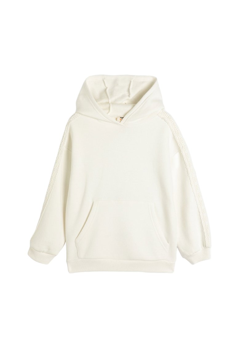 Biały hoodie z kieszenią z przodu, długimi rękawami i koronkowymi detalami na ramionach. Wykonany z miękkiego materiału o luźnym kroju.