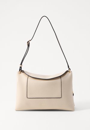 Beige leather shoulder bag with a black trim, featuring a structured shape, gold hardware, and a front pocket. Smooth texture.