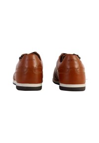 Brown leather shoes with white rubber soles, featuring a smooth finish, round toe design, and subtle stitching details.