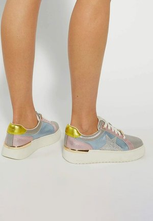 Colorful sneakers featuring a mix of metallic silver, blue, pink, and gold materials with a star accent and white rubber sole.