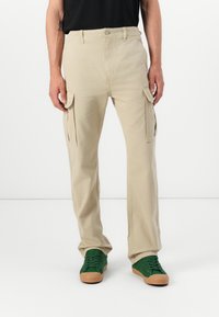 Tommy Jeans OTIS HERRINGBONE PANTS - Cargo trousers - silt