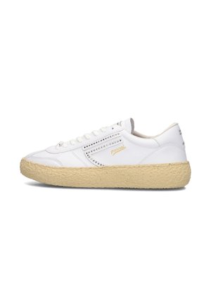 White sneakers with a textured, light brown sole, featuring a silver accent and perforated detailing on the side.