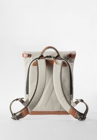 Beige and brown backpack with padded shoulder straps, top handle, and adjustable buckles on a plain white background.