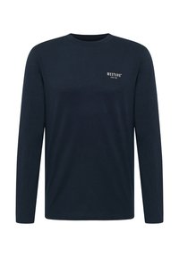 Navy blue long-sleeve cotton t-shirt with crew neck, features small white "MUSTANG" logo on the chest, smooth texture, and regular fit.