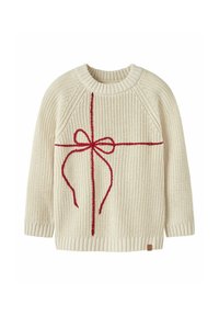 Maglione lavorato a maglia color crema con un design a fiocco rosso al centro, colletto e polsini a coste, e un piccolo etichetta sull'orlo.