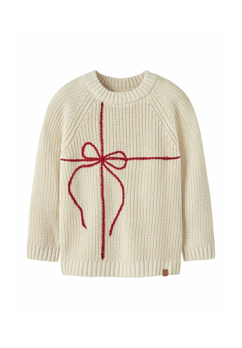 Maglione lavorato a maglia color crema con un design a fiocco rosso al centro, colletto e polsini a coste, e un piccolo etichetta sull'orlo.