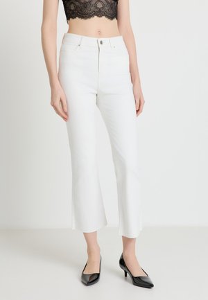 LUNGO UNITA - Jeans a zampa - bianco denim