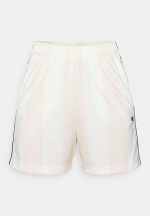 Lettvåkts atletiske shorts i lys beige med hvite vertikale striper, med elastisk midjebånd og svarte sidestriper, utstyrt med en logoapplikasjon.