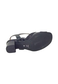Sandalo con tacco nero dal design elegante, con tomaia texturizzata, fascia larga e tacco solido leggermente rialzato. Taglia 36.