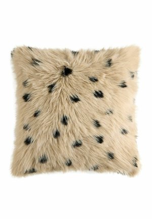 Square beige furry cushion with scattered small black spots on a white background.