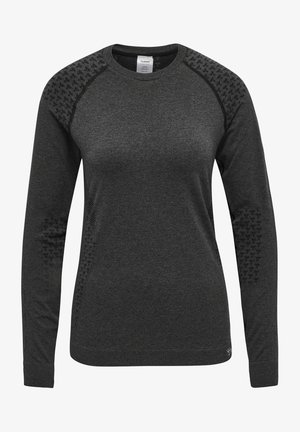 Svart långärmad sweatshirt med texturerade detaljer på axlarna, rund crew neck och ribbad fåll. Tillverkad av lätt och andningsbart material.