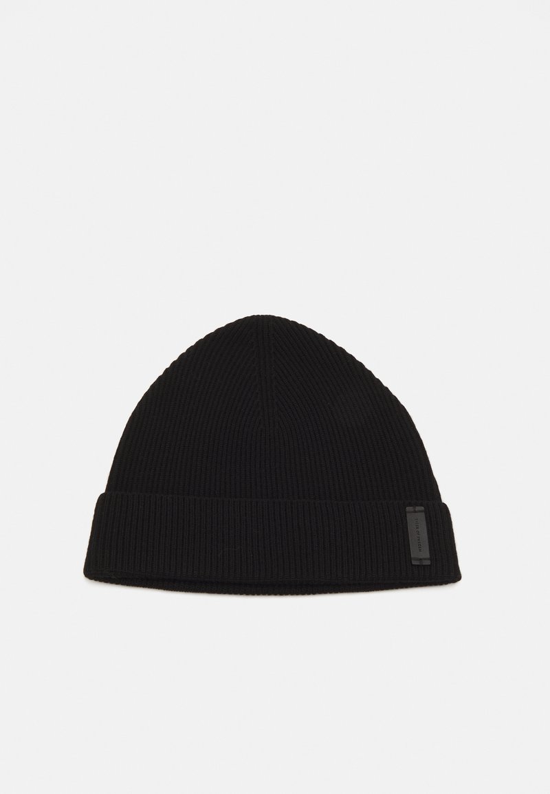 Black beanie made of ribbed knit fabric; features a turned-up cuff and a small, rectangular logo patch on the side.