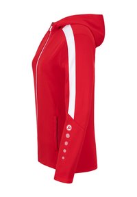 Giacca rossa con cappuccio, dotata di chiusura con zip, strisce laterali bianche e dettagli con bottoni sulle maniche. Realizzata in materiale liscio e leggero.