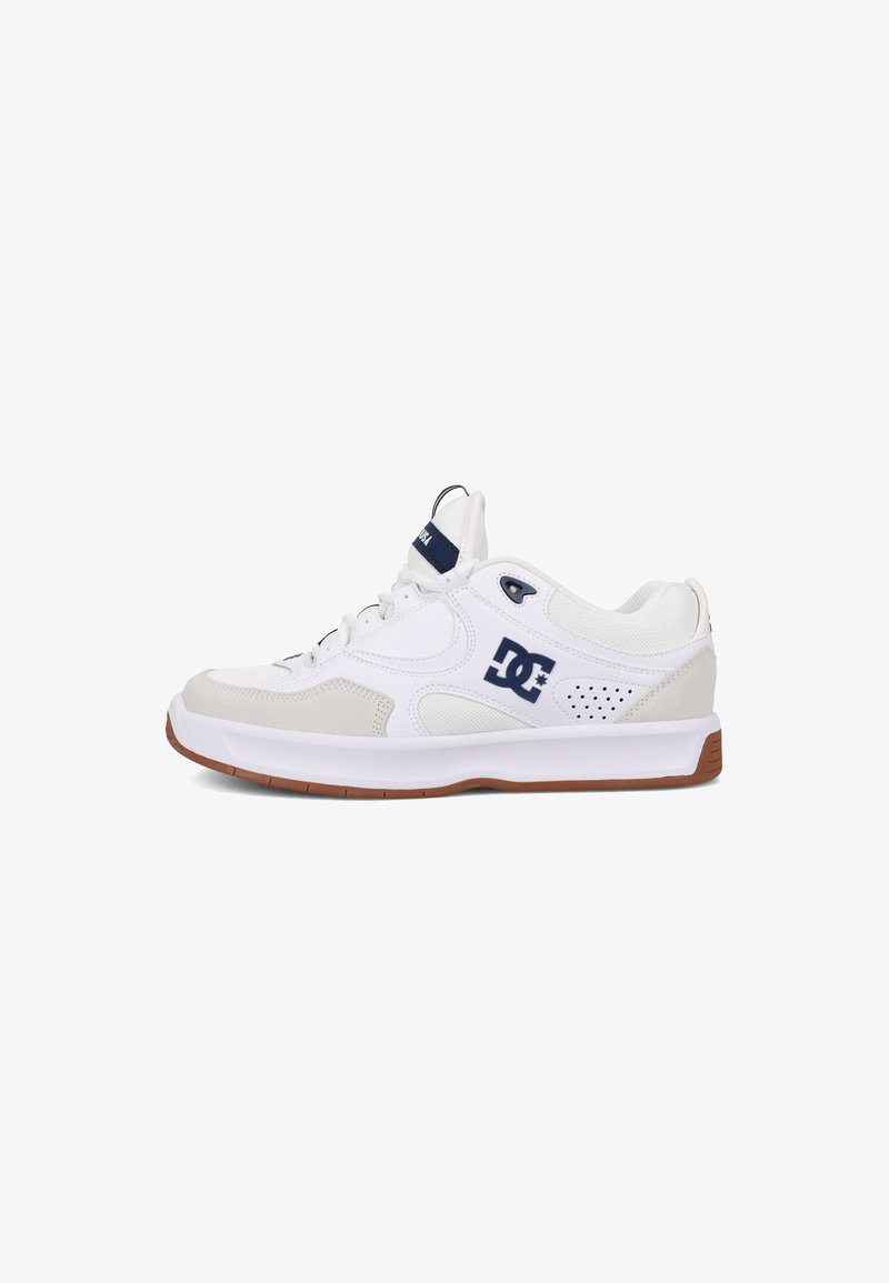 White athletic shoe featuring a mix of smooth and suede materials, blue accent logo, perforated sides, and a brown rubber sole.