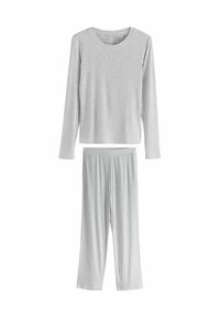 Heledad hall-särg ja sobivad lahtised püksid pidžaamasegment, mis on valmistatud pehmest ja kergest kangast.