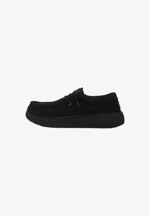 Black suede shoe with a rounded toe, lace-up design, and rubber sole. Features subtle stitching and a textured back panel.
