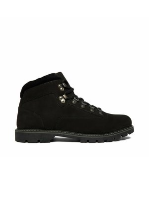 Black ankle-high hiking boot with metal eyelets, padded collar, thick rubber sole, and rugged tread, shown in side profile on white background.