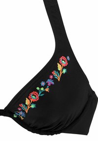 Svart bikinitopp med fargerik blomsterbroderi på den ene siden. Har en myk tekstur og justerbare stropper for bedre passform.