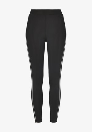 Musta leggingsit, jotka on valmistettu joustavasta materiaalista, ja joissa on korkea vyötärö sekä valkoiset sivuraitat jaloissa. Sileä pinta, tiukka muotoilu.