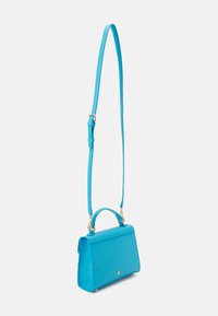 Turquoise leather handbag with a structured shape, top handle, and adjustable shoulder strap. Features gold hardware and a smooth texture.