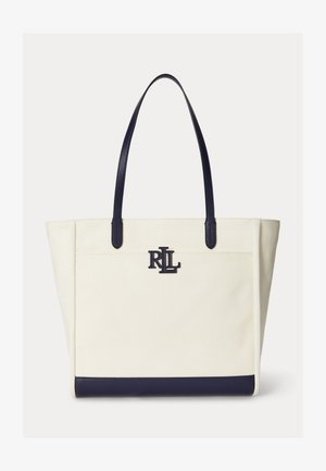 Kremfarget lerretstote med håndtak og bunnkant i marineblått skinn, med en marineblå "RLL"-logo midt foran.