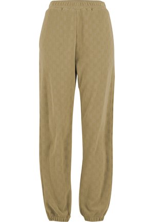 Beige strikkede bukser med et teksturert, rutete mønster. Elastisk midjebånd og smale ben med elastiske mansjetter. Mykt stoff.