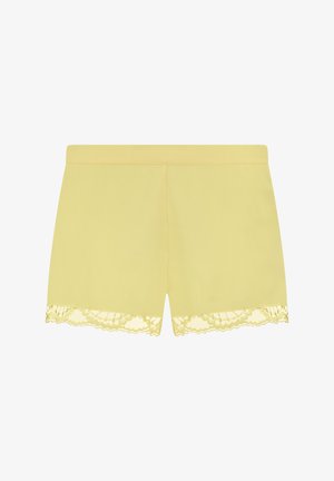 Żółte szorty wykonane z miękkiego materiału, z falbaniastej koronkowej lamówką u dołu. Gładka tekstura o prostym wzorze i bez kieszeni.