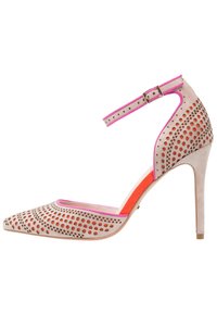 Beige suede high heels with perforated patterns, pink accents, a pointed toe, and a thin ankle strap. Features a high stiletto heel.