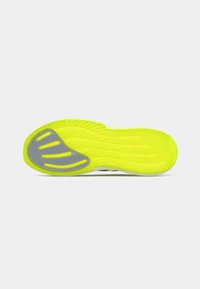 Sole of a shoe with bright yellow rubber and grey accent areas. Textured for grip, with curved grooves and ridges for traction.
