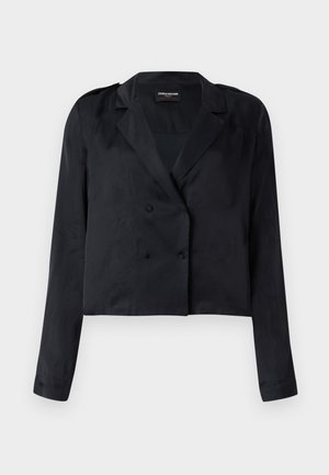 Mustast krobelõikega bleiser satiinise viimistlusega, kahe rea nööpide, sälguga krae ja pikkade varrukatega. Omadused: sile tekstuur ja minimalistlik disain.