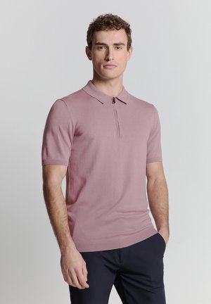 Korte mouwen polo shirt van zacht roze breiwerk met een kraag en een halve ritssluiting. Heeft ribgebreide randen en een getailleerd ontwerp.