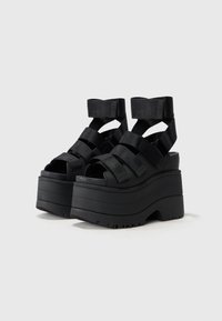 UGG GOLDENRISE - Sandali con plateau - black