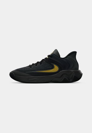 Black and dark gray athletic shoe with black laces and gold swoosh logo, featuring a wavy sole design and padded heel collar.