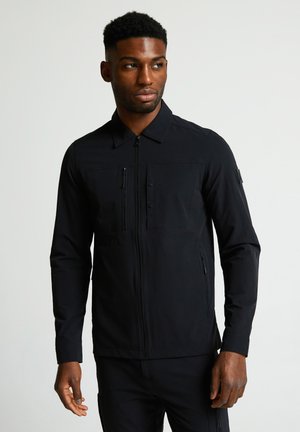 Schwarze Zip-Jacke mit langen Ärmeln, Knopfklappentaschen und strukturierter Oberfläche. Verfügt über einen klassischen Kragen und besteht aus leichtem Stoff.