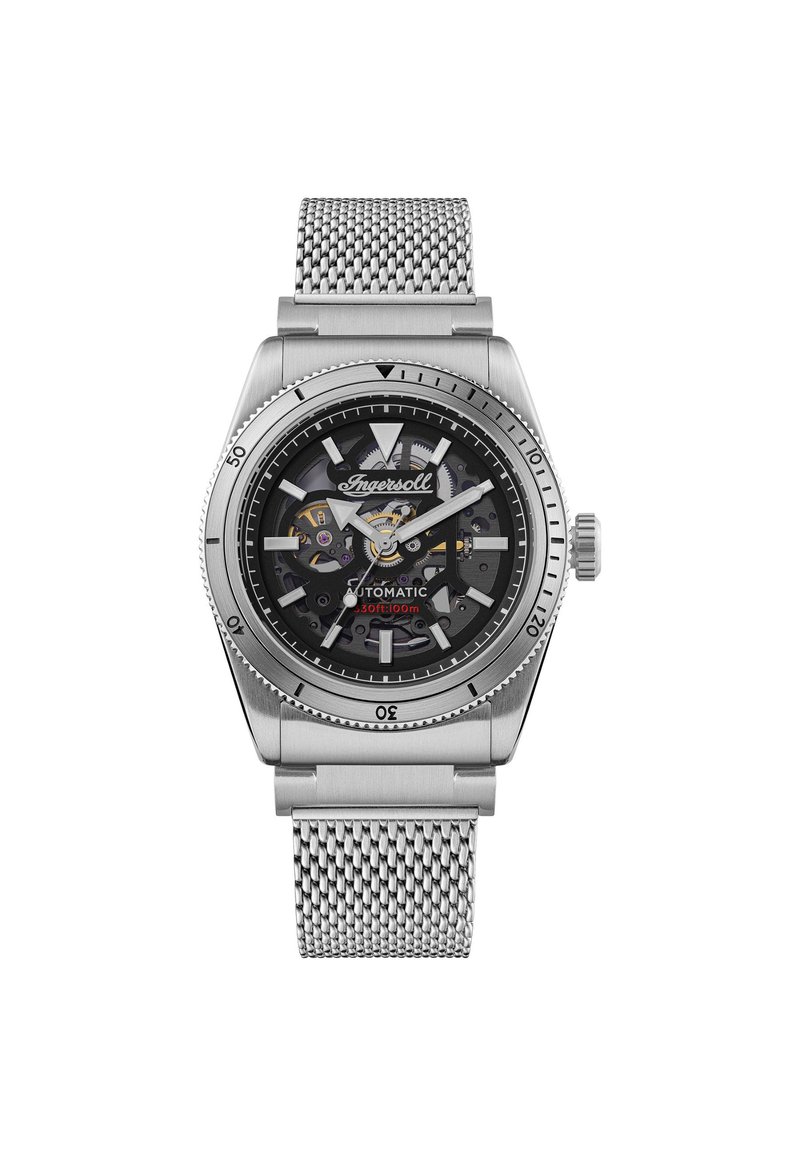 Silberne Automatik-Uhr mit einem Mesh-Armband, schwarzem Ziffernblatt, sichtbaren inneren Mechaniken und einer drehbaren Lünette mit erhabenen Minutenmarkierungen.