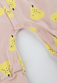 Pink bodysuit with yellow pear patterns, featuring snap closures at the bottom. Soft fabric with smooth texture and contrasting navy accents.