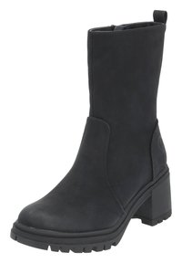 Svarta ankelskor med en slät, matt textur. Kraftig klack och gummisula med ett mönster. Sido paneldetalj och dragflik på baksidan.