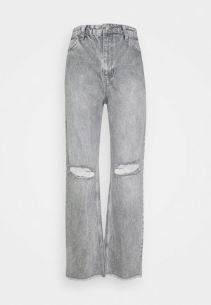 Hoge taille, brede pijpen spijkerbroeken van lichtgrijze denim, met gescheurde kniestukken en een ruwe zoom. Klassiek ontwerp met vijf zakken en subtiele vervaging.