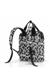 Gray backpack with black leopard print, featuring adjustable black straps, zippered top, and side pockets. Textured fabric.