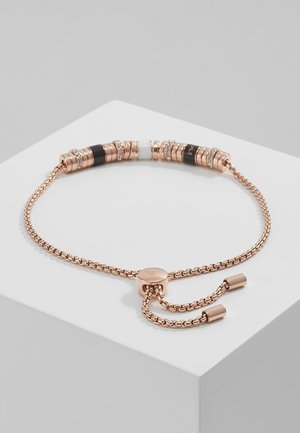 Adjustable rose gold chain bracelet with black, white, and rhinestone-accented cylindrical beads on a white display surface.