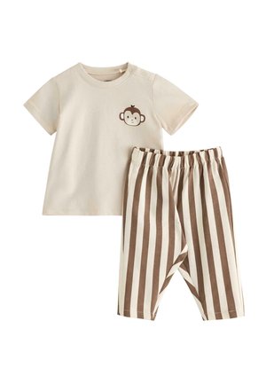 Kortærmet babybluse i cremefarve med abeansigt-grafik, kombineret med matchende creme- og brune bukser med lodrette striber og elastisk talje.