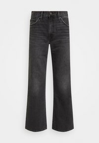 Jeans en denim noir évasés avec une taille haute, quatre poches et des coutures ton sur ton. Dotés d'une fermeture à bouton en métal et d'un design classique à cinq poches.