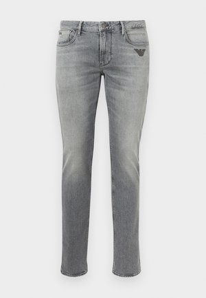 Gray denim jeans with a straight leg cut, featuring a slight fade, front pockets, and a small embroidered logo on the upper left.